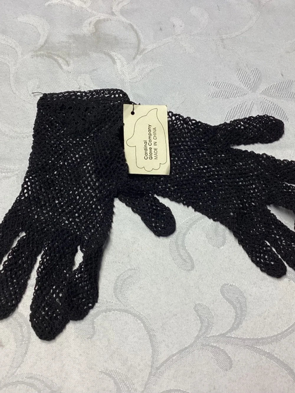 Black fishnet gloves never worn absolutely gorgeous. Detailed